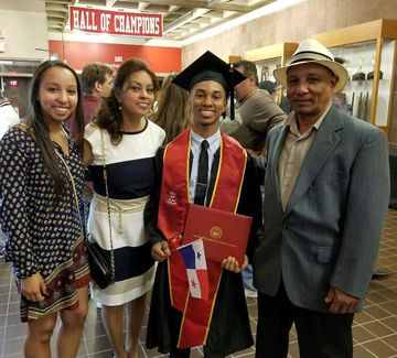 Reylu Gutierrez and family pose for a photo after his 2017 graduation.